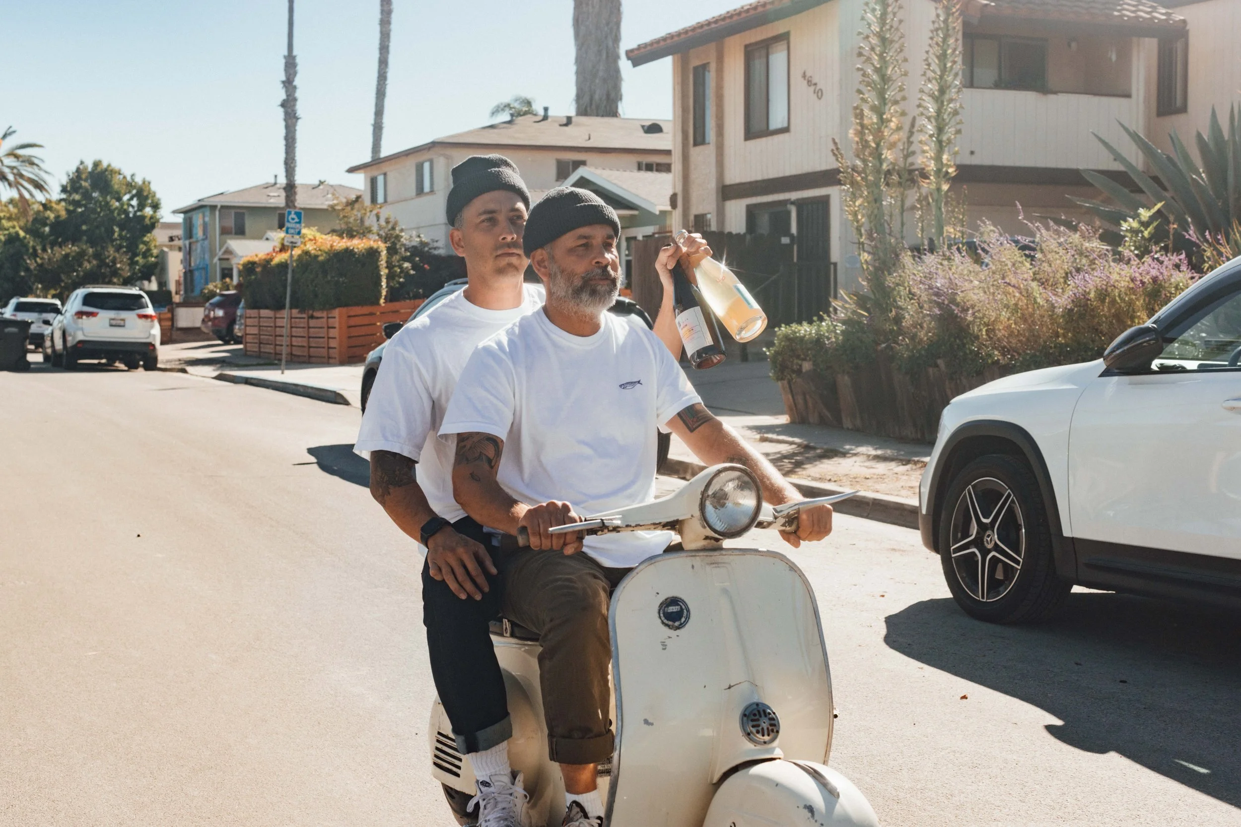 The bica team on their cream Vespa in the neighborhood